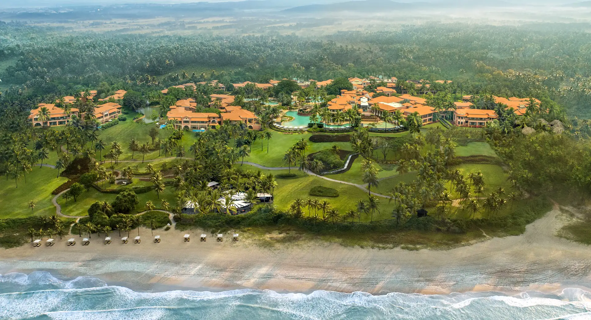 Aerial view of ITC Grand Goa resort on Arossim Beach, a beach wedding venue in South Goa